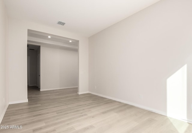 unfurnished room featuring light hardwood / wood-style flooring