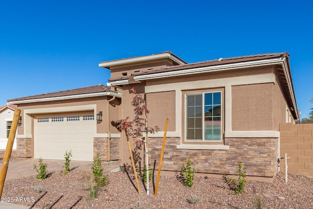 prairie-style house featuring a garage