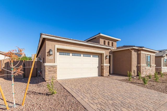 prairie-style home featuring a garage