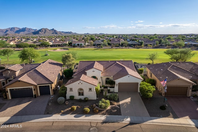 birds eye view of property with a mountain view