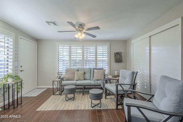 living room featuring ceiling fan