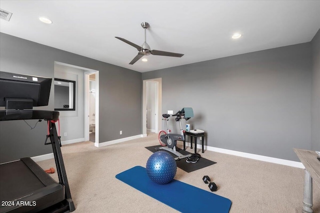 workout area featuring ceiling fan and carpet floors