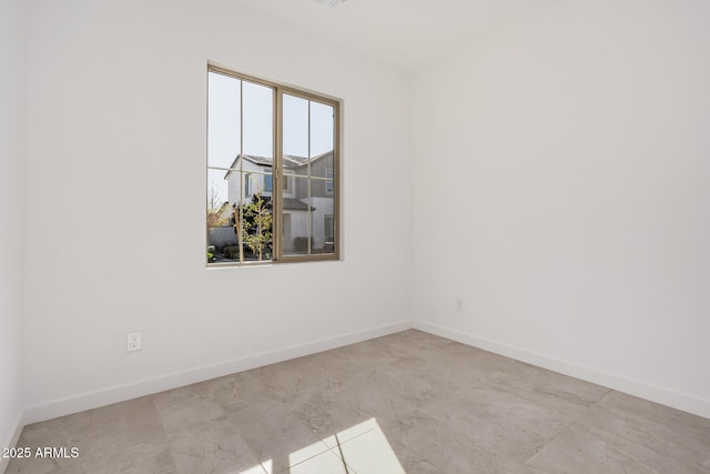 empty room with light tile patterned floors