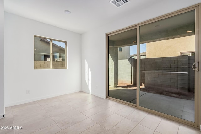 empty room with light tile patterned floors