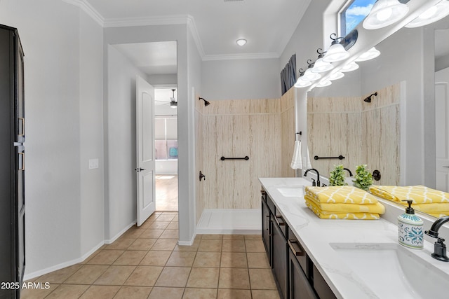 full bathroom featuring a sink, tile patterned floors, and tiled shower