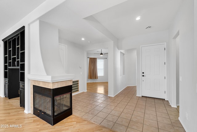 entryway featuring visible vents, baseboards, ceiling fan, recessed lighting, and light tile patterned floors