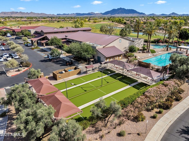 drone / aerial view featuring a water and mountain view and a residential view