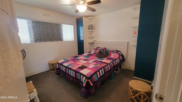 bedroom with baseboards and a ceiling fan