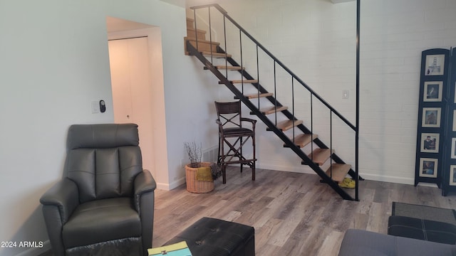 stairs featuring baseboards and wood finished floors