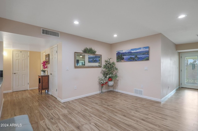 spare room with light hardwood / wood-style flooring