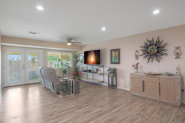 living room featuring ceiling fan, light wood-type flooring, and french doors