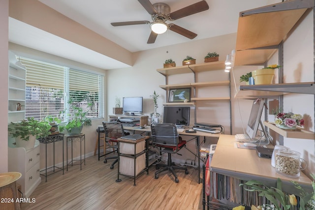 office area with light wood-type flooring and ceiling fan