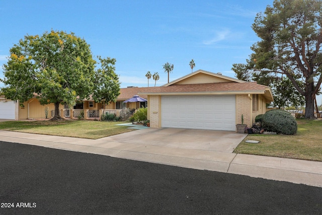 view of front facade featuring a garage and a front lawn