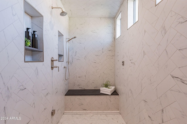 bathroom featuring tiled shower