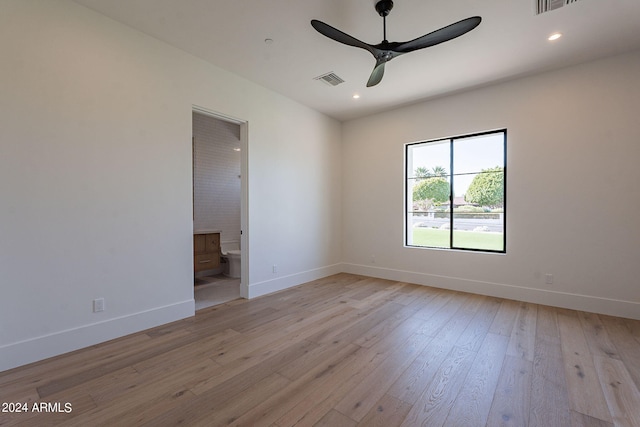 spare room featuring ceiling fan and light hardwood / wood-style flooring