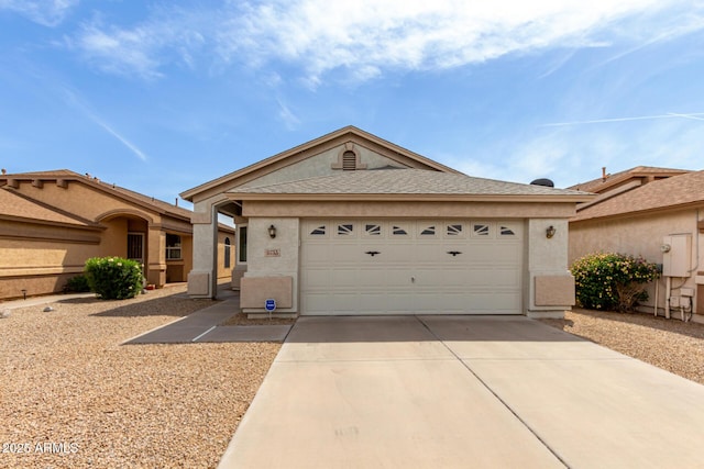ranch-style home featuring stucco siding, a garage, concrete driveway, and roof with shingles