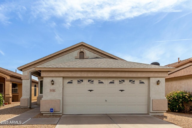 ranch-style house featuring a garage, concrete driveway, stucco siding, and roof with shingles
