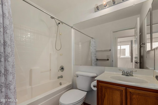 bathroom featuring toilet, vanity, and shower / bath combo