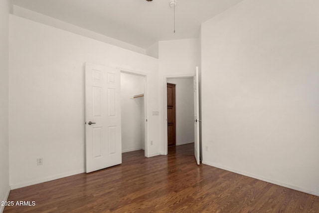 unfurnished bedroom featuring baseboards and wood finished floors