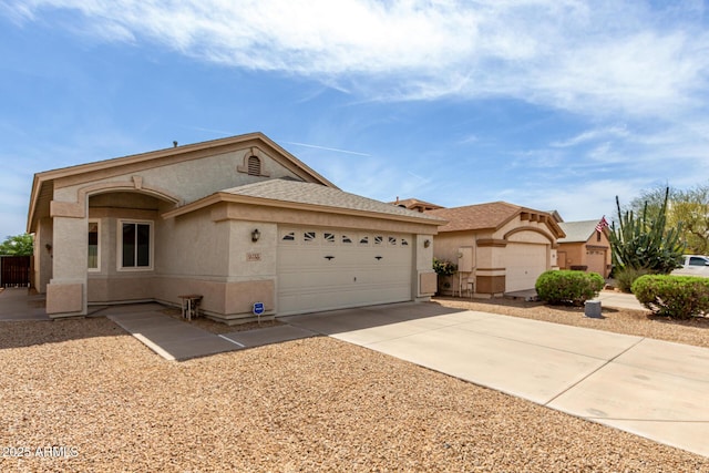single story home featuring stucco siding, concrete driveway, and a garage