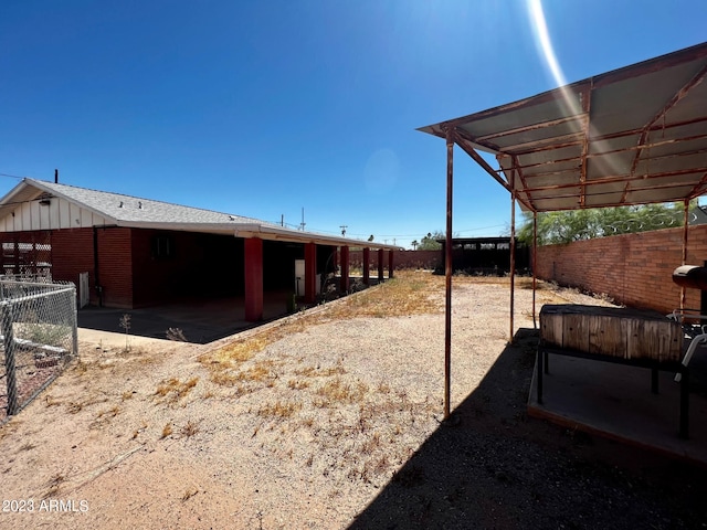 view of yard with a carport