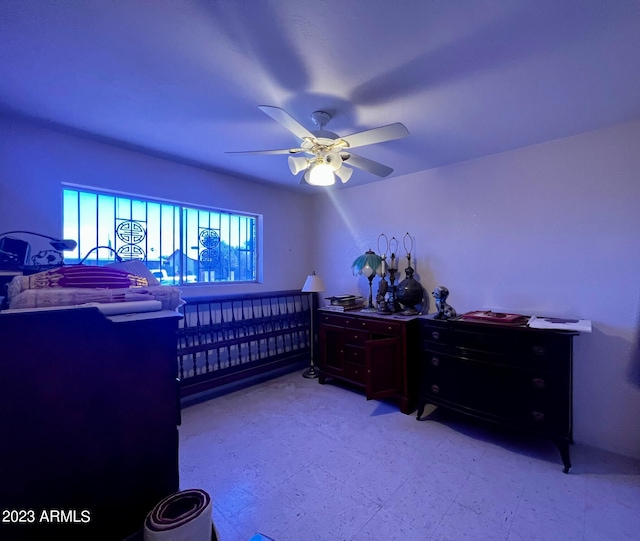tiled bedroom featuring ceiling fan
