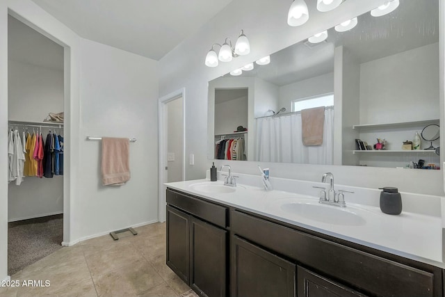 bathroom with vanity and tile patterned flooring