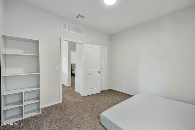 bedroom featuring dark colored carpet