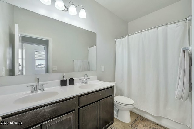 full bathroom featuring shower / tub combo with curtain, vanity, toilet, and tile patterned floors