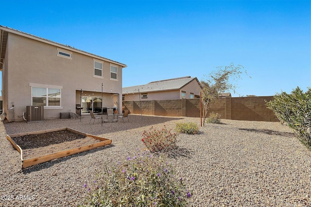 back of house featuring a patio and central air condition unit