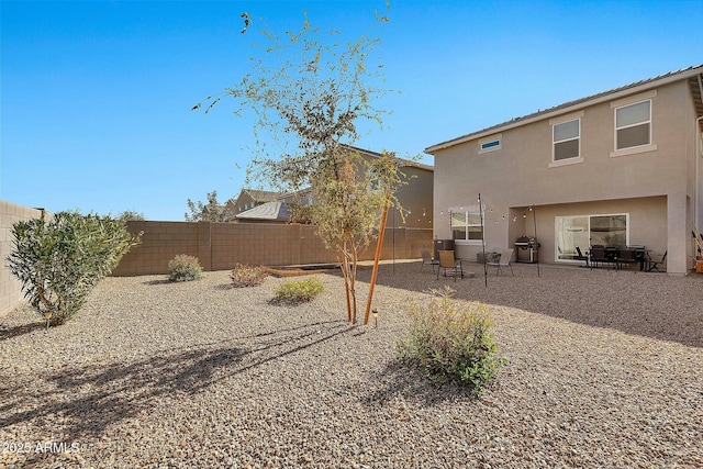 back of house with a patio