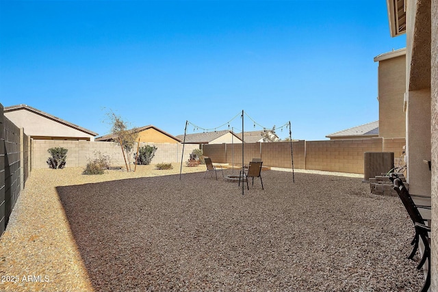 view of yard with cooling unit and a patio area