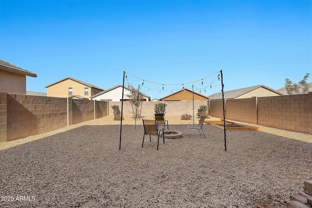 view of playground with a patio and an outdoor fire pit