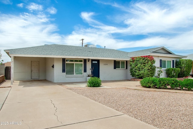 508 S Ernie Pl, Tempe, AZ 85281 - single story home with brick siding, a shingled roof, driveway, and an attached carport
