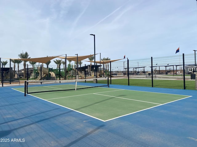 view of sport court with community basketball court and fence