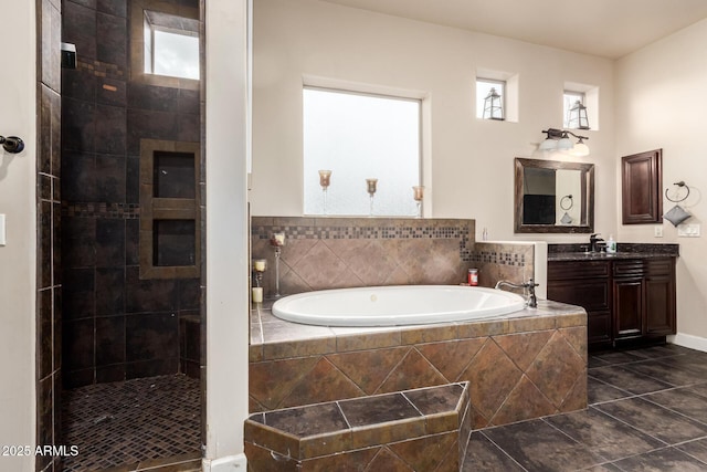 full bath featuring tile patterned floors, tiled shower, a garden tub, and vanity