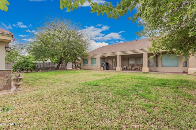 view of yard featuring a patio and fence