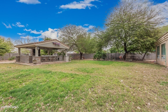 view of yard with a gazebo and a fenced backyard