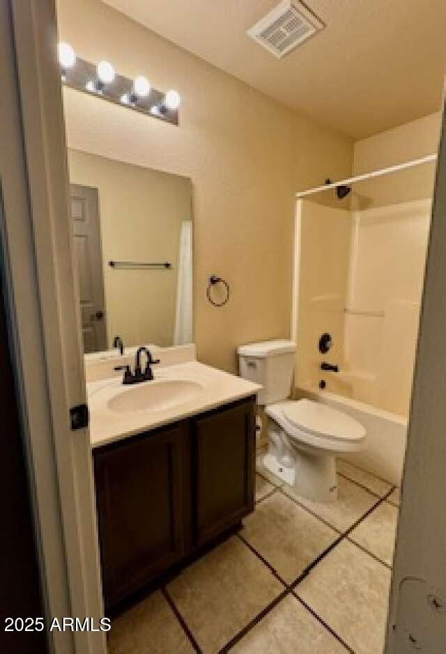 full bathroom featuring visible vents, toilet, tile patterned floors,  shower combination, and vanity