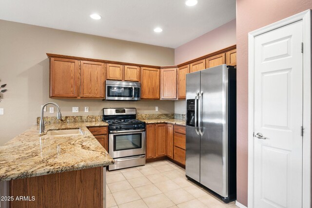 997 Fairway Dr, Dewey, AZ 86327 - kitchen featuring a sink, brown cabinets, stainless steel appliances, and a peninsula