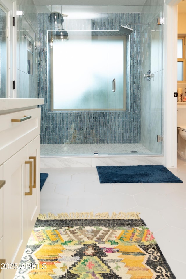 136 E Vera Ln, Tempe, AZ 85284 - bathroom featuring a shower stall, vanity, and plenty of natural light