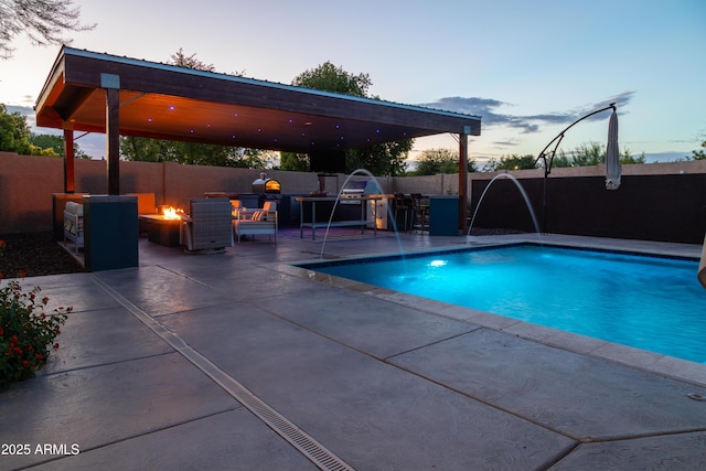 136 E Vera Ln, Tempe, AZ 85284 - pool at dusk featuring a fire pit, a patio, and a fenced backyard