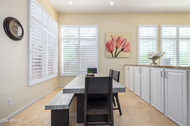 tiled dining space with plenty of natural light