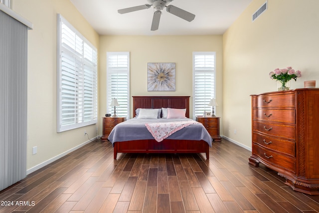 bedroom with ceiling fan and dark hardwood / wood-style flooring