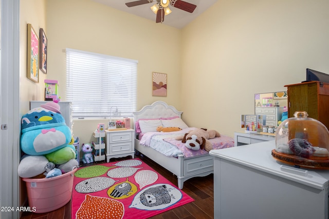 bedroom with ceiling fan, dark hardwood / wood-style flooring, and lofted ceiling