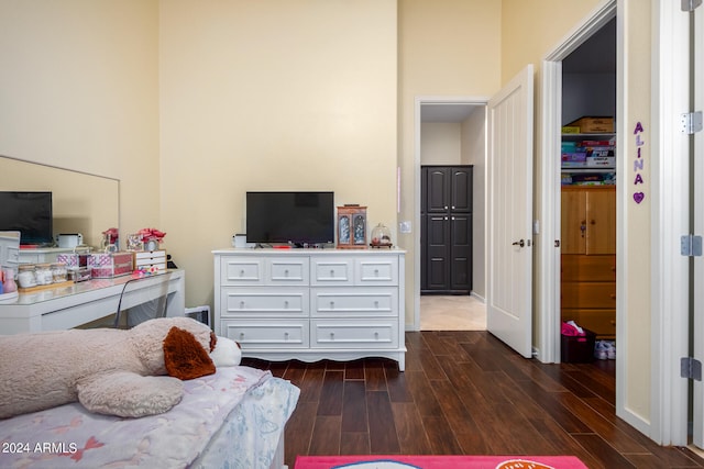 bedroom featuring dark wood-type flooring