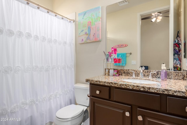 bathroom featuring vanity, toilet, and ceiling fan