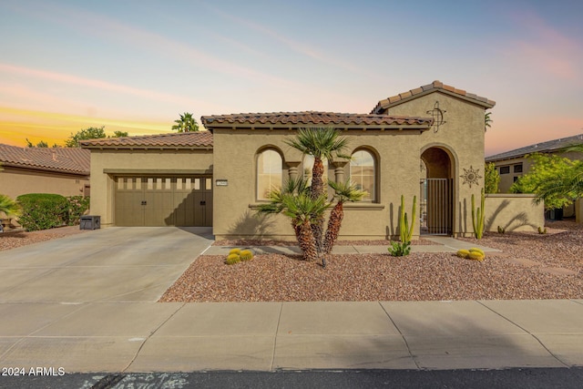 mediterranean / spanish-style house featuring a garage