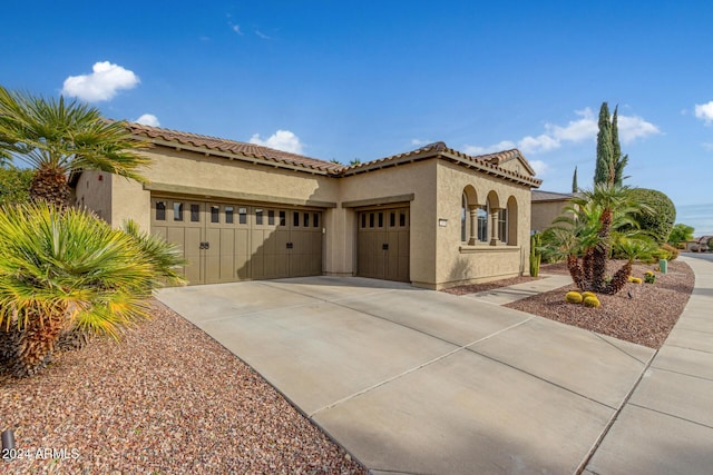 mediterranean / spanish-style house featuring a garage