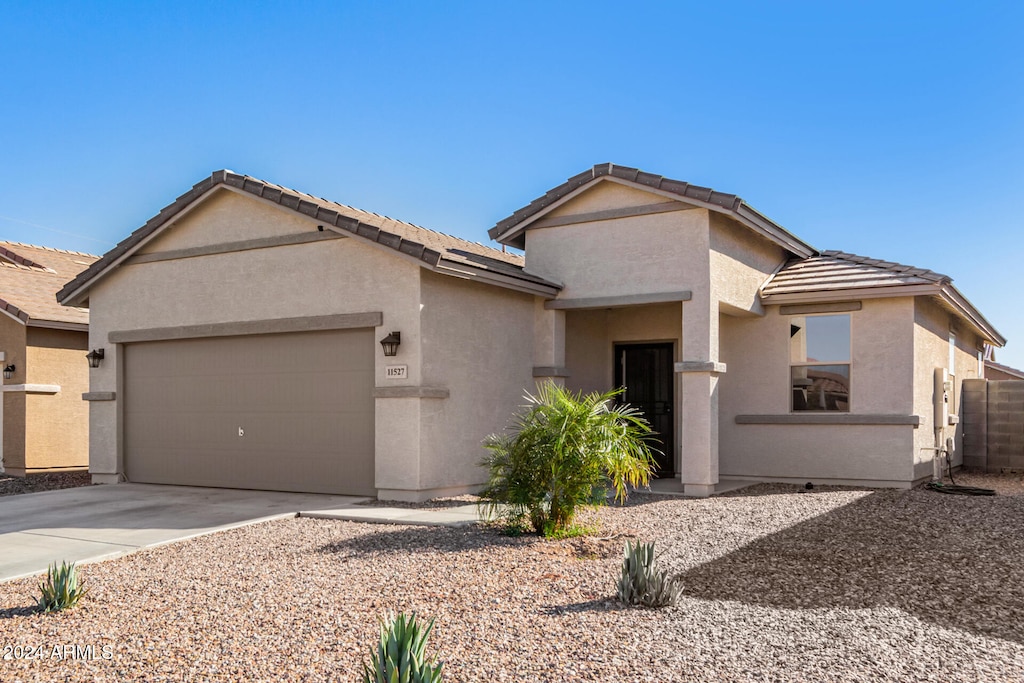 single story home featuring a garage